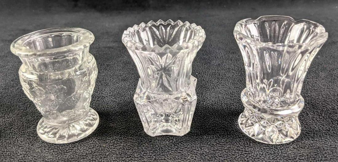 Three Clear Glass Pod Vases Or Toothpick Holders: Three Clear Glass Pod Vases Or Toothpick Holders. Both range about 2" x 2" x 2 1/2" and the makers and date of creation is unknown. Together they weigh under one pound at 0.65lb and all are in a good,