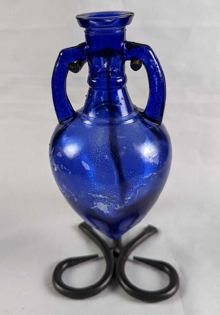 Cobalt Blue 6.1 oz. Amphora Single Glass Cruet: Cobalt Blue 6.1 oz. Amphora Single Glass Cruet. Is glass with a 'Cobalt Blue' color wrap around the glass. Is missing its top and parts of the cobalt blue covering has come off. Please see the images 