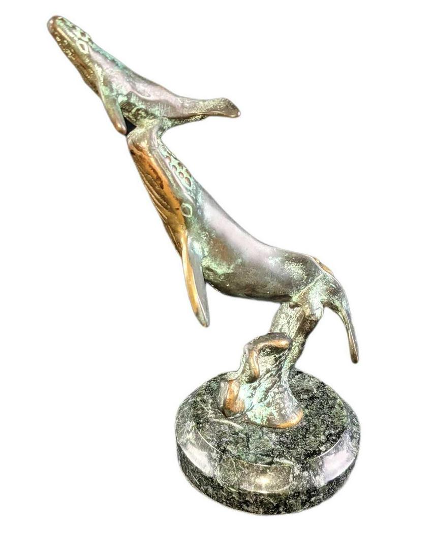 SPI Gallery Surfacing Whale With Baby Brass Figurine: SPI Gallery Surfacing Whale With Baby Brass Figurine. Has a patina giving the figurine more of a bronze look. Is approx 3" x 3" x 7" and weighs 1.39lb. The figurine is in a good used condition with no