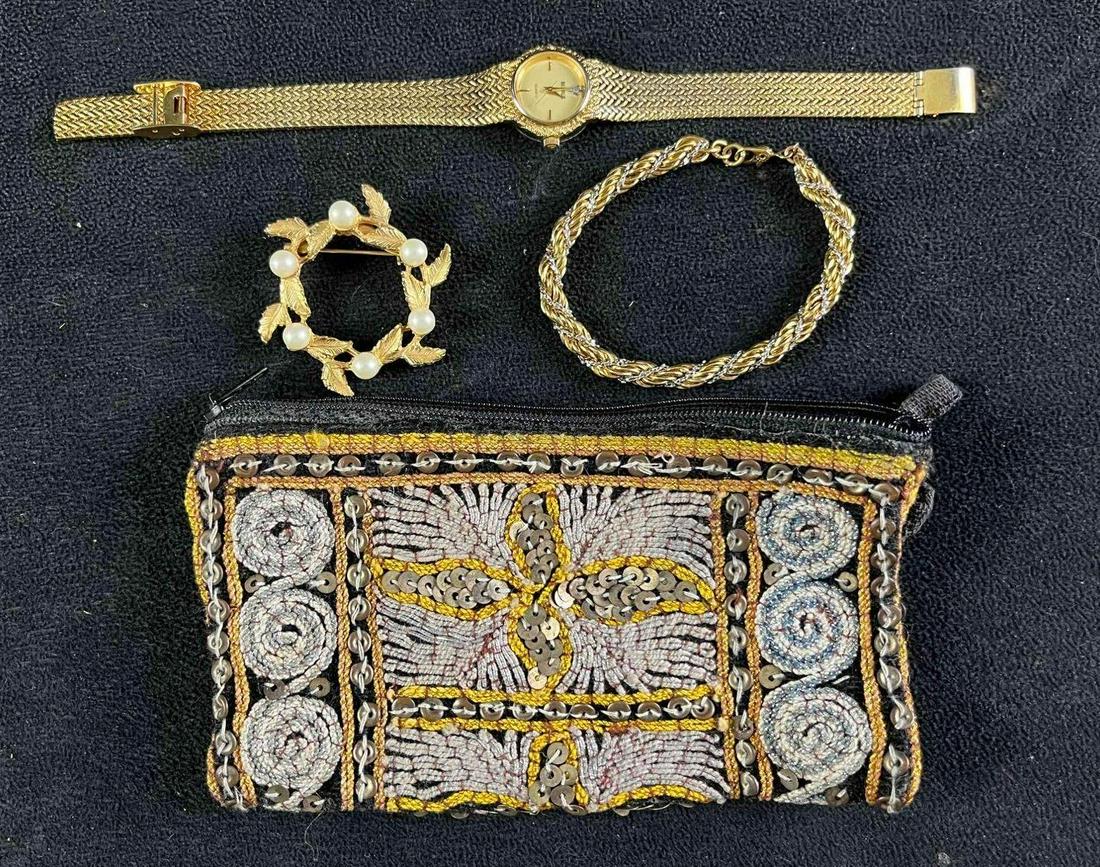 Gold Colored Assorted Jewelry and Embroidered Pouch: Gold Colored Assorted Jewelry and Embroidered Pouch Pictured are four items, a pin, a bracelet, a watch, and a pouch. Each item is in good condition with no major damage. The watch has not been tested