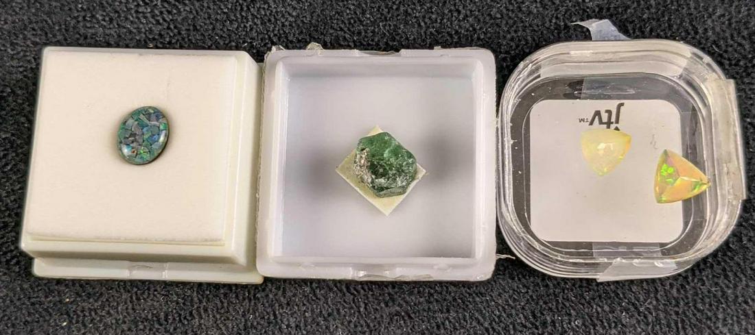 Lab Grown Rough Zambia Emerald Opal And Triplet Opal: This lot includes: (1) Opal Triplet. This is approx 8mm x 10mm x 2.9mm. (2) Opals. These are approx 9mm x 9mm x 1.9mm. (1) Rough Zambia Emerald 9.8mm x 10.2mm x 8.88mm All are in a good, unused condit