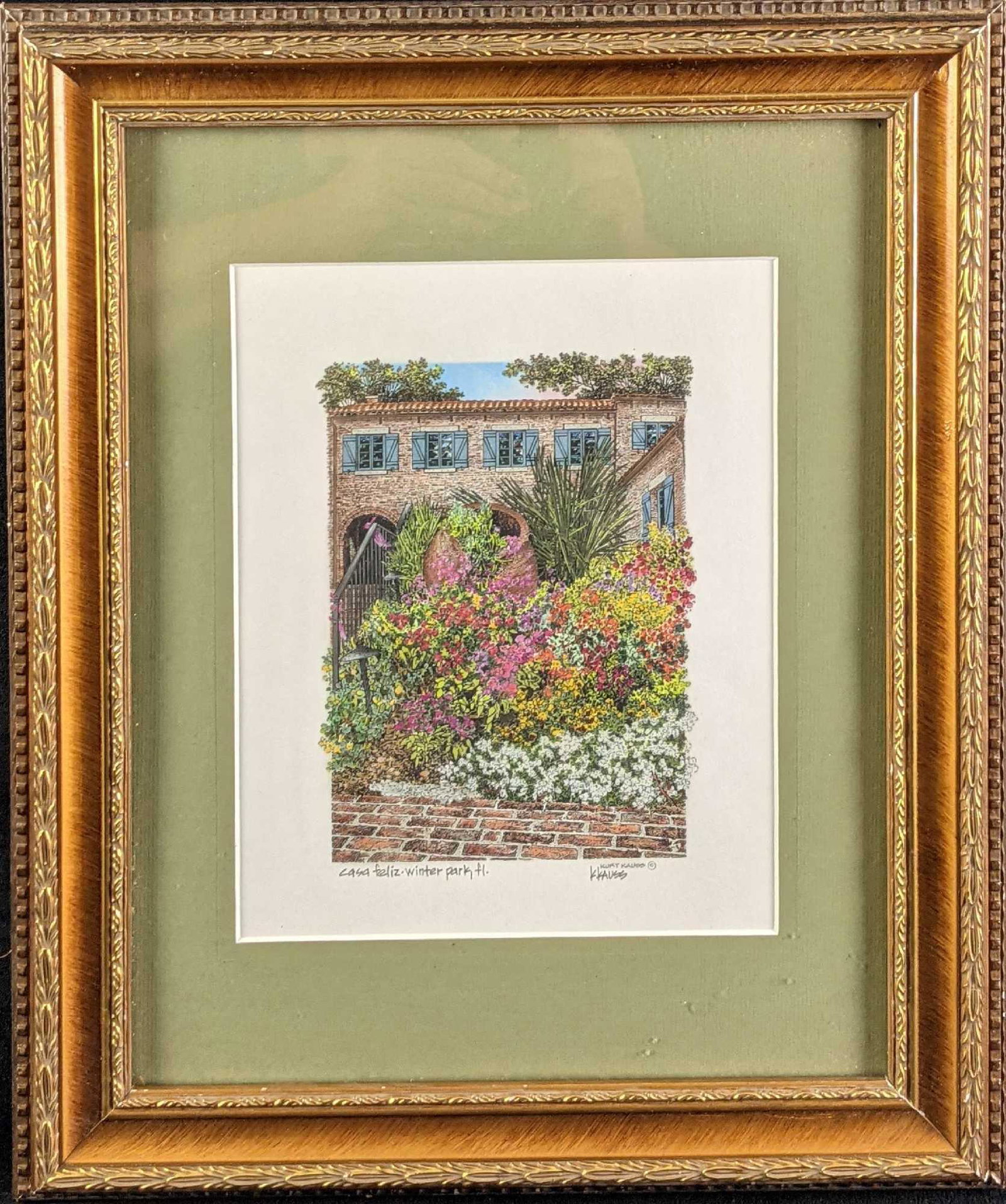 Framed Kurt Kauss Florida Casa Feliz Print: "Casa Feliz - Winter Park" Print by Kurt Kauss. This print is framed and signed by the artist on the bottom right. The framed print is approx 14" x 1" x 17" and weighs 3.04lbs. The print is approx 7 1