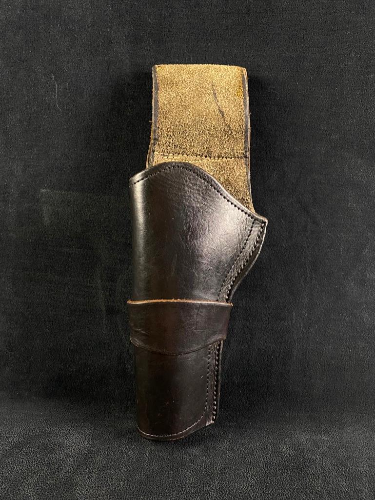 Black Left-Handed Holster for .45 Revolver: Black Left-Handed Holster for .45 Revolver Vintage leather holster in black for .45 revolver. Has open bottom, and suede on the inside and belt loop. Leather is in great condition, with very little we