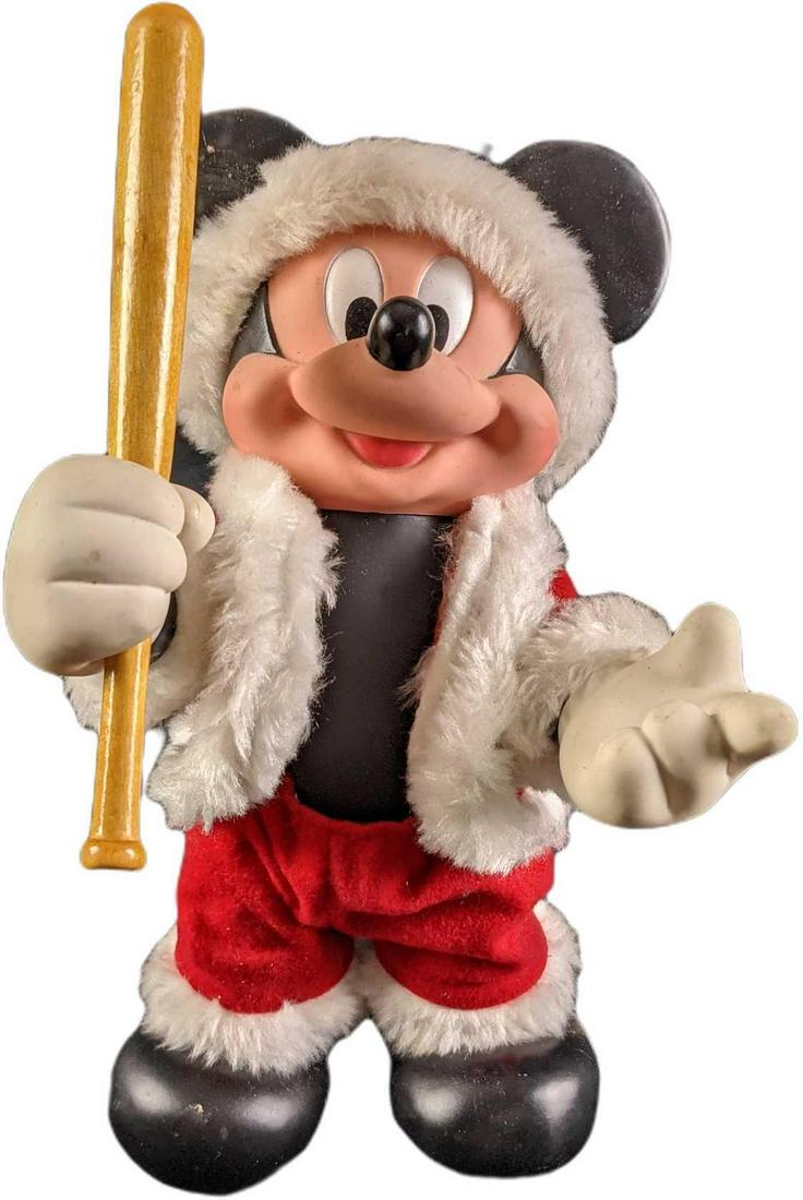 Disney Rubber Santa Mickey Mouse With A Bat: Disney Rubber Santa Mickey Mouse With A Bat. He used to carry a bell, now he has a bat! Is approx 6" x 5" x 11" and it weighs under one pound at 0.72lb. Fully posable. The doll has some markings on it