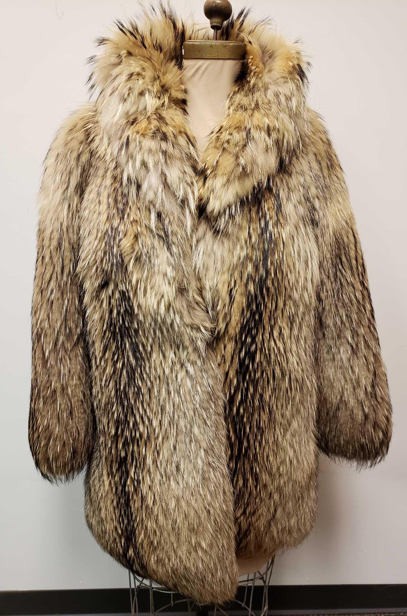 Borello Torino Murmasky Fur Coat: Borello Torino Murmasky Fur Coat. This fur coat is in great used condition. The coat has no known interior or exterior damage. The coat has a light brown interior lining with a Borello Torino tag. The