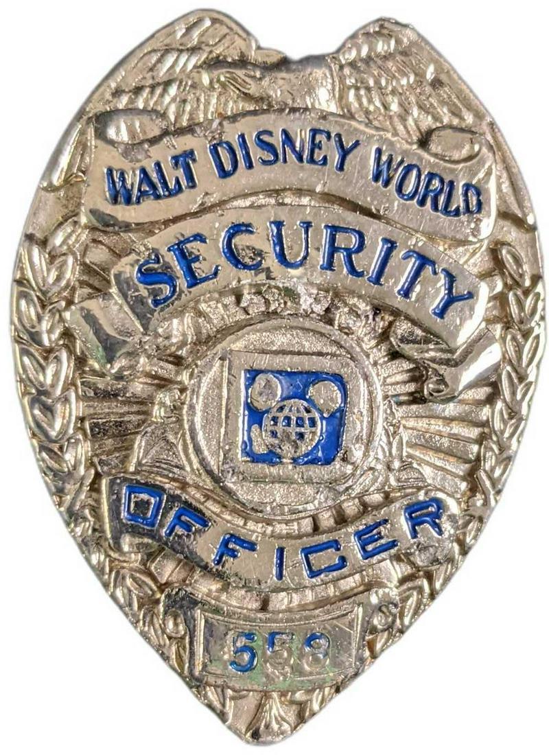 Early 1980s Disney World Female Security Metal Badge: 1970/1980s Disney World Female Security Metal Badge. Is approx 1 1/2" x 1" x 2" and it weighs under one pound at 0.09lb. The metal badge is in a good, vintage condition with some chips over the Mickey