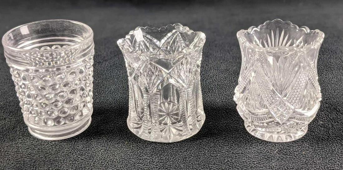 Three Clear Glass Pod Vases Or Toothpick Holders: Three Clear Glass Pod Vases Or Toothpick Holders. Both range about 2" x 2" x 2 1/2" and the makers and date of creation is unknown. Together they weigh under one pound at 0.64lb and all are in a good,
