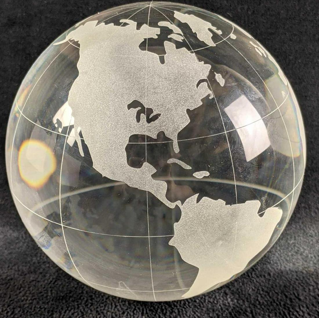 Glass Globe Paper Weight: Glass Globe Paper Weight This glass globe has countries on it with latitude and longitude lines. The countries may not be correctly shown but the glass globe is too cool to pass up. This globe has app