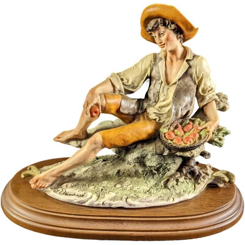 JB Giuseppe Armani Figurine - Man With Pears: Giuseppe Armani Capodimonte Porcelain Figurine - "Man With Pears". This is approx 11" x 5 1/2" x 10" and it weighs 4.71lbs. The figurine is in a good, used condition with some markings on the back. Pl