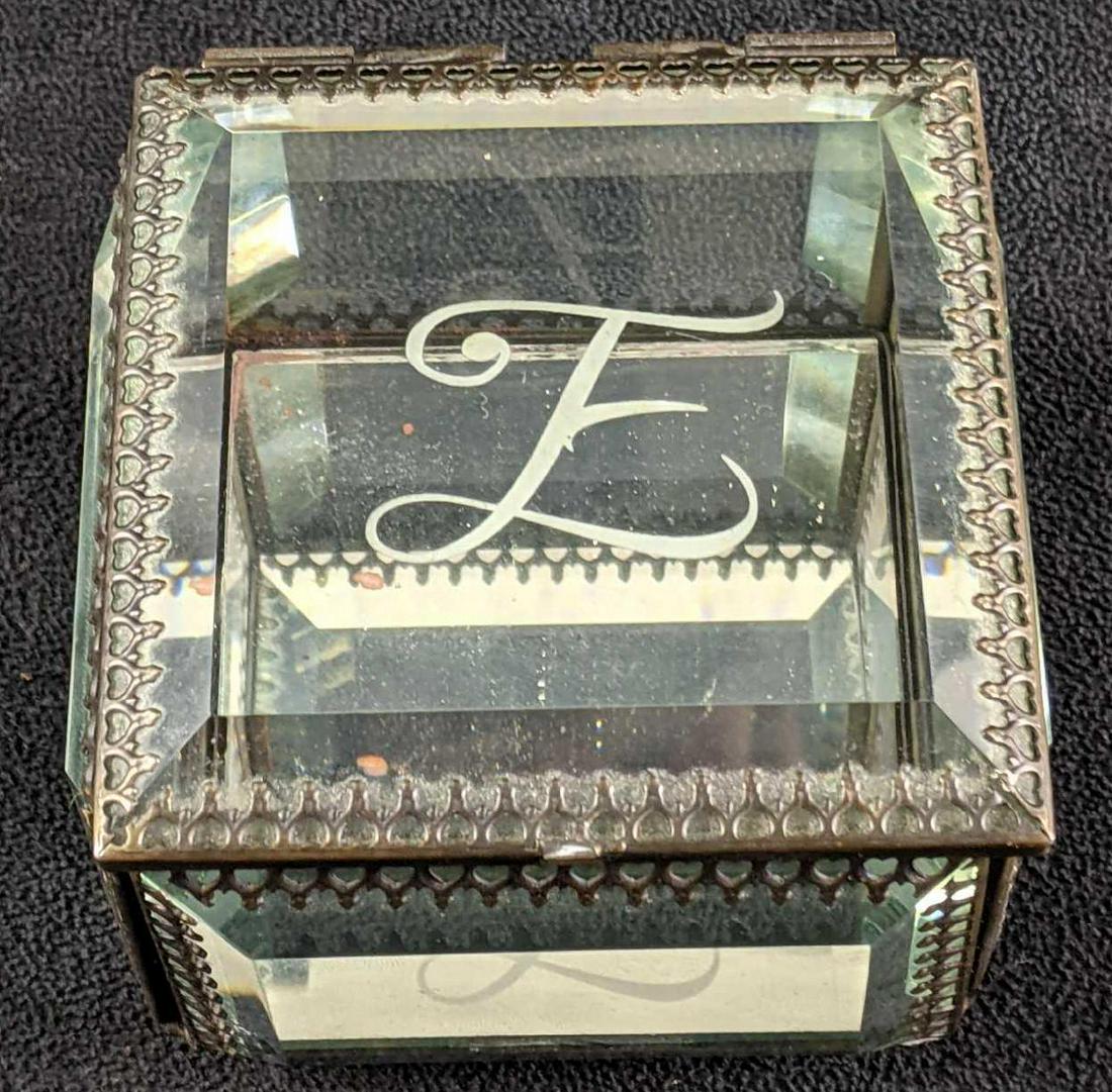 Glass Jewelry Box With E with Beveled Glass: Glass Jewelry Box With E with Beveled Glass This is a beautiful beveled glass jewelry box. There is no known damage to this box it is in good condition with a personalization of the letter E on the to