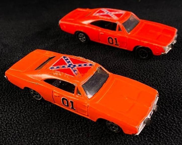 Two Early 1980s Dukes of Hazzard General Lee Ertl: Two Early 1980s Dukes of Hazzard General Lee Ertl Vintage General Lee Dodge Charger from the Dukes of Hazzard, made by Ertl, dated 1981. These 1/64 scale die-cast cars have some wear on the paint and