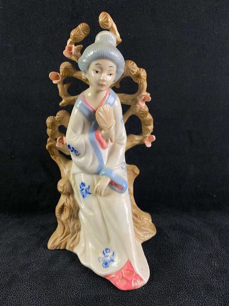 Lenwile Ardalt Geisha Girl Figurine Taiwan: Lenwile Ardalt Geisha Girl Figurine Taiwan Vintage porcelain figurine of a Geisha girl made in Taiwan by Lenwile Ardalt. Shows a woman in a kimono seated at the base of a blooming tree. In good condit