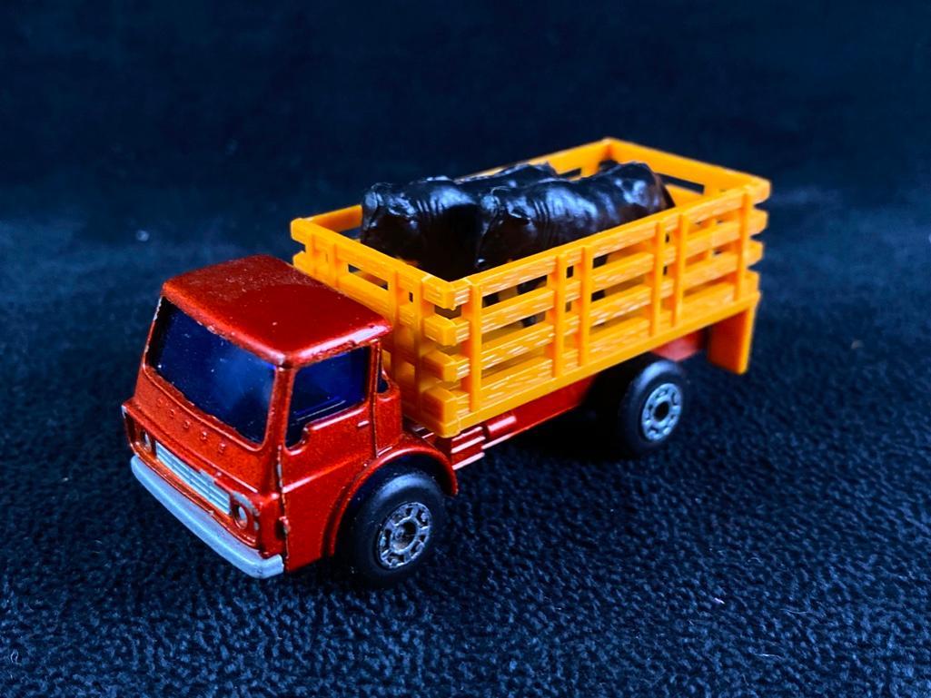 Matchbox Cattle Truck with Original Cows: Matchbox Cattle Truck with Original Cows Vintage matchbox cattle truck with two plastic black cows that go in the bed. In good condition with no known damage. Please see photos for best description of