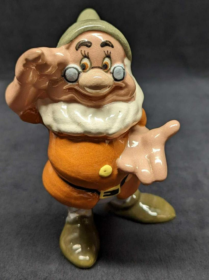 1940s Disney Doc Dwarf Evan K Shaw Pottery Figurine: 1940s Disney Doc Dwarf Evan K Shaw Pottery Figurine. This figurine is approx 4" x 3 3/4" x 6" and it weighs 0.19lb. The figurine is in a good, vintage condition with crazing all over the figurine and 