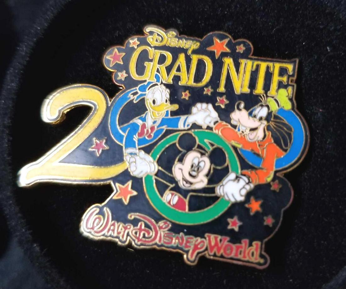 Lot of 3 Grad Night year 2000 Walt Disney World Pins: These are Graduation pins from Walt Disney World. They have an event every year for the graduating classes. Each pin comes with a graduation cap box. They are in good condition. The plastic box has so