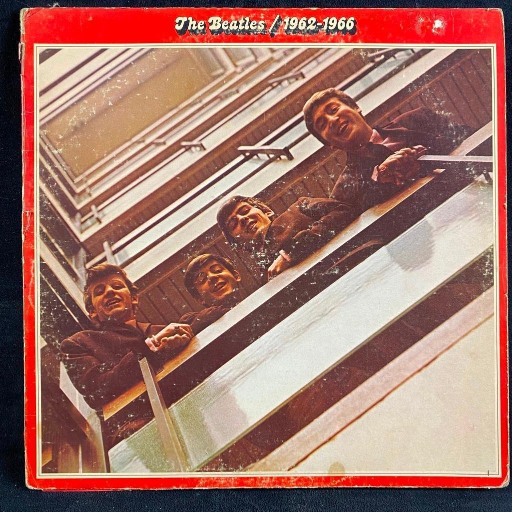The Beatles / 1962-1966 Vinyl Compilation Album: One of the first greatest hits albums by The Beatles, with their best songs from 1962-1966. Includes Love Me Do, Yesterday, I Wanna Hold Your Hand, Yellow Submarine, and many others. The sleeve is in 