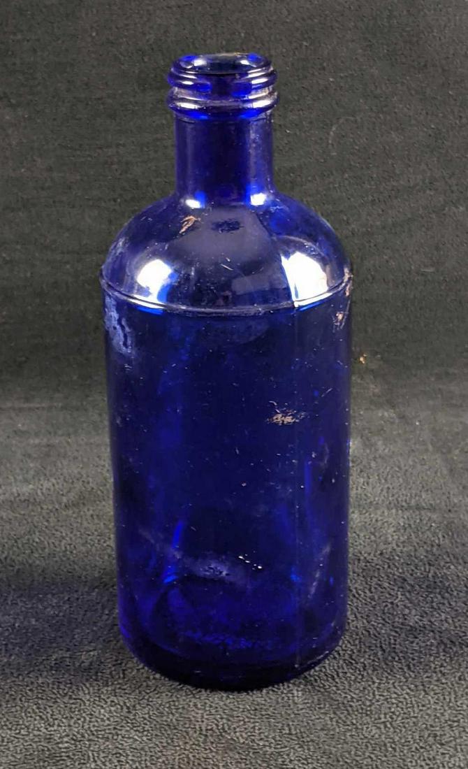 Vintage Cobalt Blue Bottle: Vintage Cobalt Blue Bottle This cobalt blue bottle is from the early 1900s. There are no makings besides an "M" on the bottom of the bottle. This is and was a rare/unique color for a bottle. This item