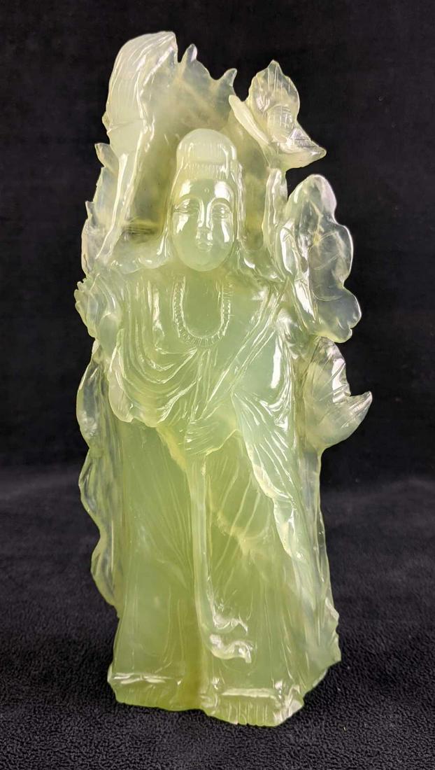 Vintage Jade Carving: Vintage Jade Carving This Jade carving is light green. The intricate designs are beautiful in their light green color. It comes with a wooden stand. there is no known damage. there are inventory numbe