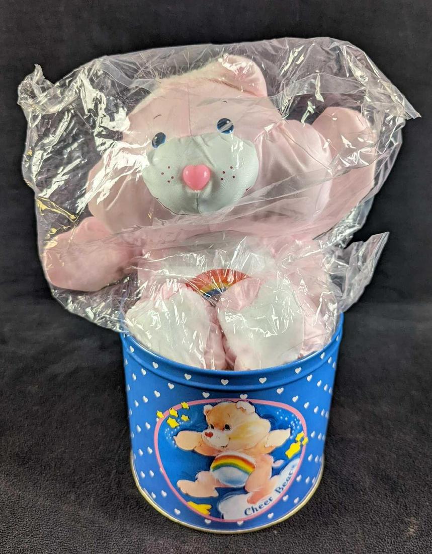 Vintage Rare Care Bear Tin With Cheer Bear Doll: Vintage Rare Care Bear Tin With Cheer Bear Doll. "Cheer Bear" is still in its wrapping. Both the tin and bear come in its original box which is approx 6" x 5 3/4" x 5 3/4" and it weighs 0.95lb. Both t