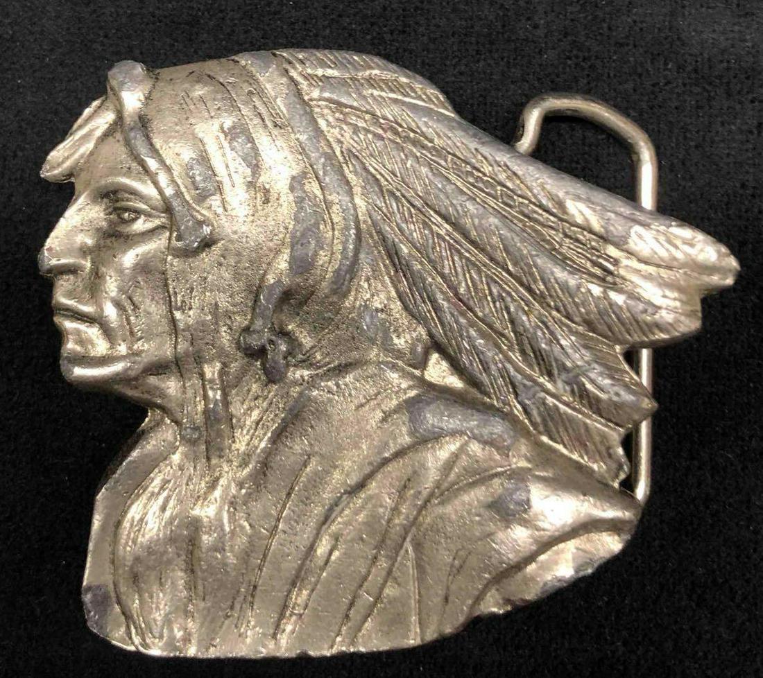 Vintage Metal Indian Head Cowboy Belt Buckle: This lot contains a vintage metal Indian head belt buckle. Perfect for any cowboy. It is approx 2 1/2" x 3" and weighs about 0.3lbs. The belt buckle is in good used condition with some ware from use o