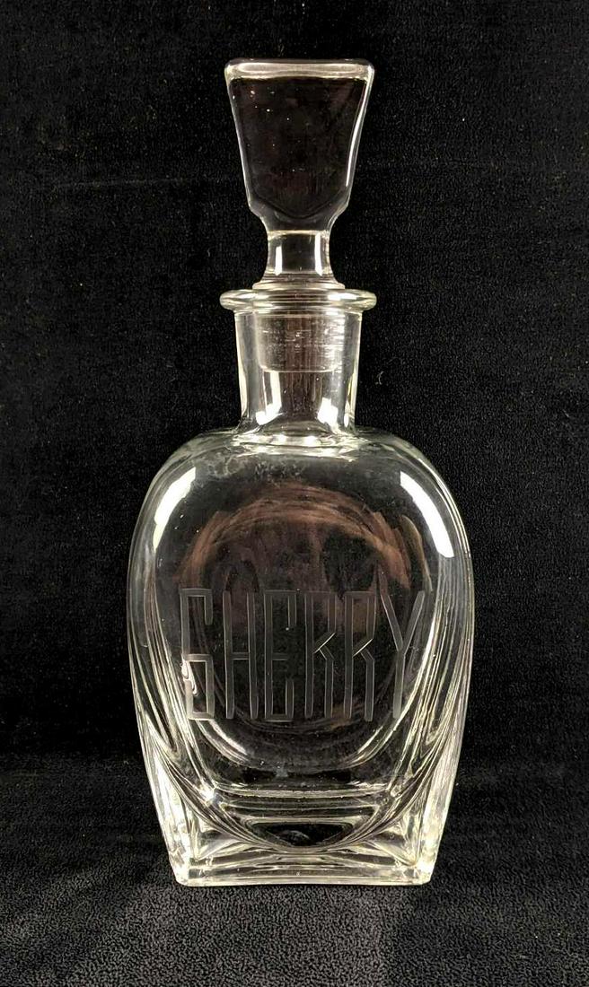 Glass Decanter Sherry Bottle Glass With Stopper: Glass Decanter Sherry Bottle Glass With Stopper This is a glass decanter labeled for your favorite Sherry to go in. This is in good condition with a few small scratches but no major damage. This decan