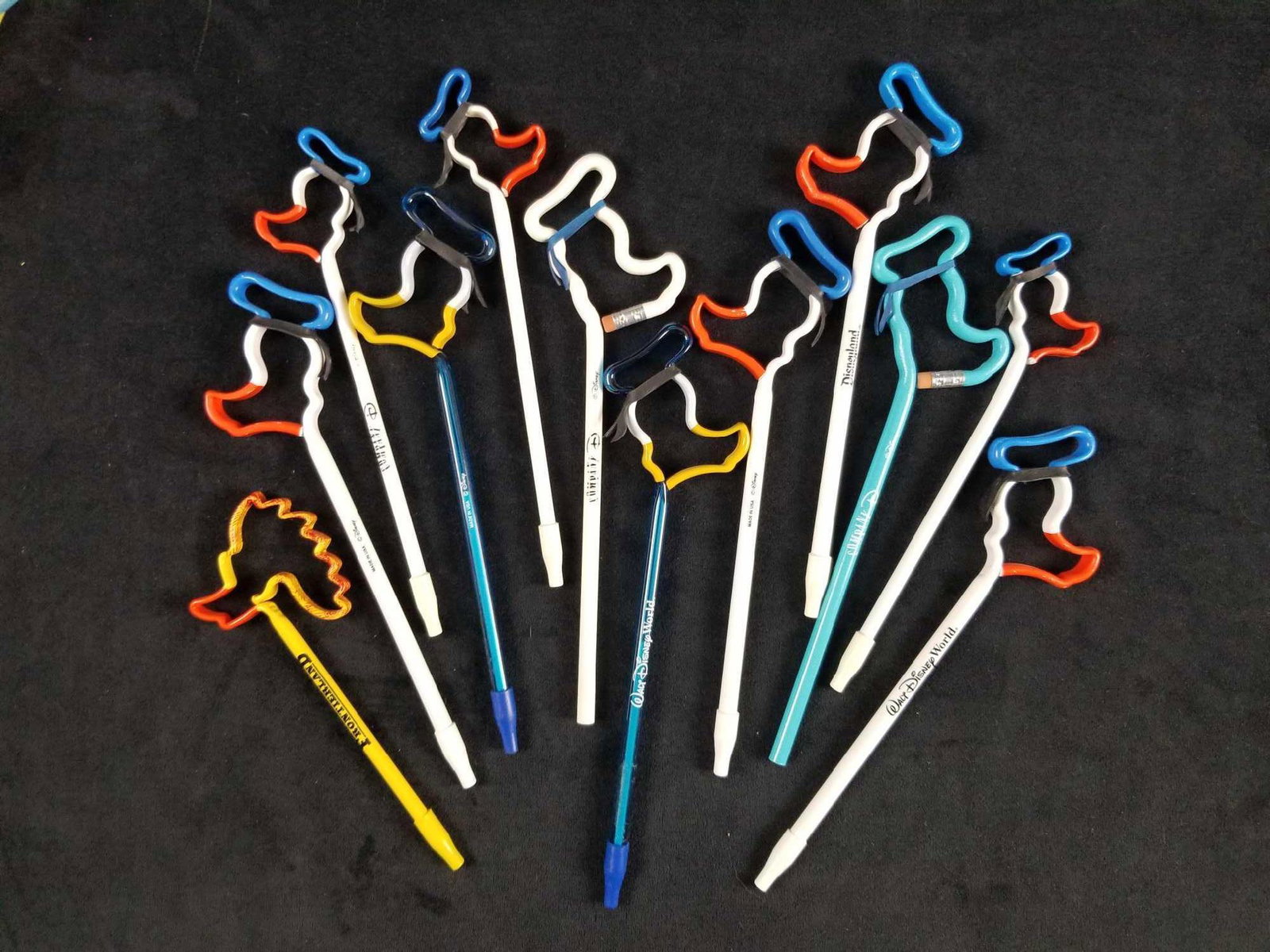 Lot Of 12 Donald Duck Outline Pen And Pencils: This lot includes twelve Donald Duck pens and pencils. The pencils are unused while the pens are dry and could be used as decoration. Comes with two unused "Company D" pencils. Company D is an Disney 