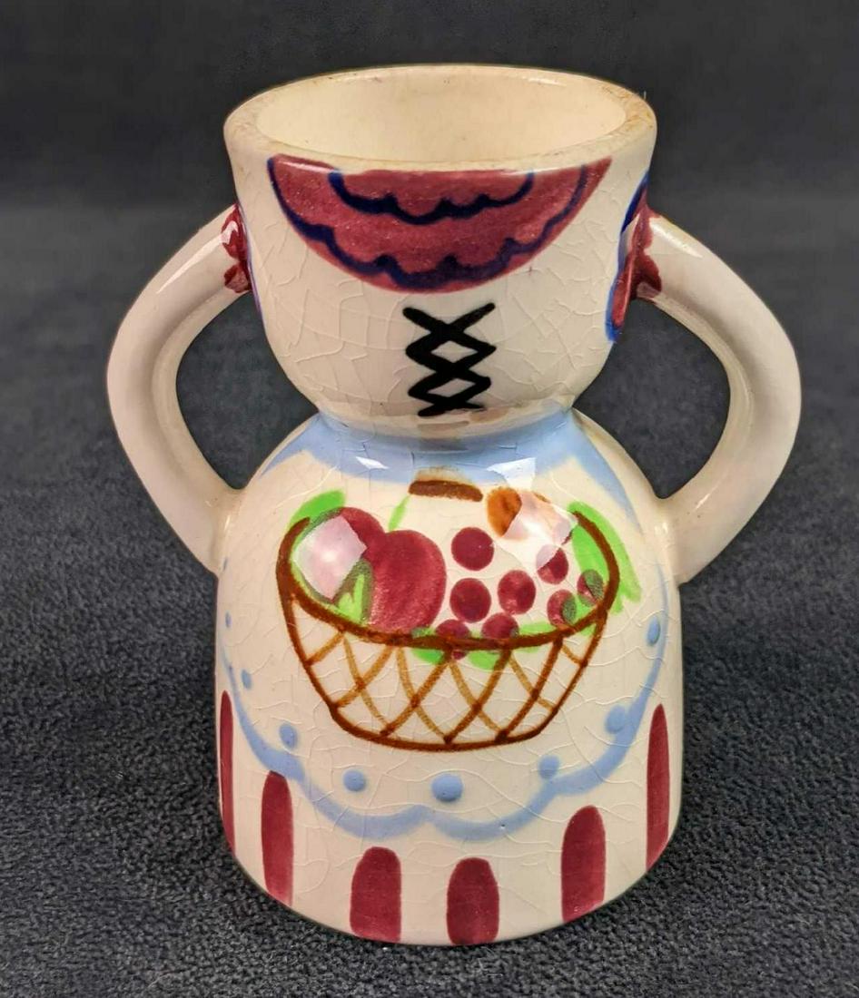 Vintage Hand Painted Napco Ceramic Egg Cup Dress: Vintage Hand Painted Napco Ceramic Egg Cup. This one has a painted design of a dress with a fruit basket. This is approx 4" x 2 1/2" x 4". Is in a good, vintage condition with wear and a slight discol