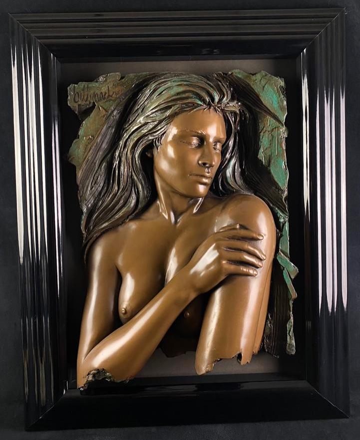 "Enchantment" by Bill Mack in Bronze: "Enchantment" by Bill Mack in Bonded Bronze An alto-relief wall statue made of bonded bronze by Bill Mack, titled Enchantment. The framed piece shows a nude woman from the mid-section up, with her arm