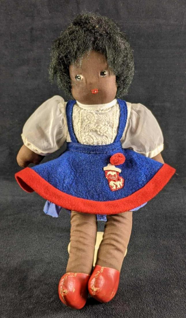 Vintage Black Americana Cloth Stuffed Doll Girl: Vintage Black Americana Cloth Stuffed Doll Girl This doll is in good condition and comes on a stand. This doll has some wear on her feet and some paint fading on her eyes. Everything else looks good t