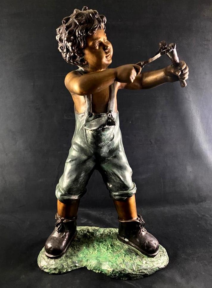 Life-Size Solid Bronze Boy Statue with Slingshot: Life-Size Solid Bronze Boy Statue with Slingshot This statue of a boy with a slingshot is made of bronze, and is solid in the head and torso, with hollow limbs and base. The intricate details heighten