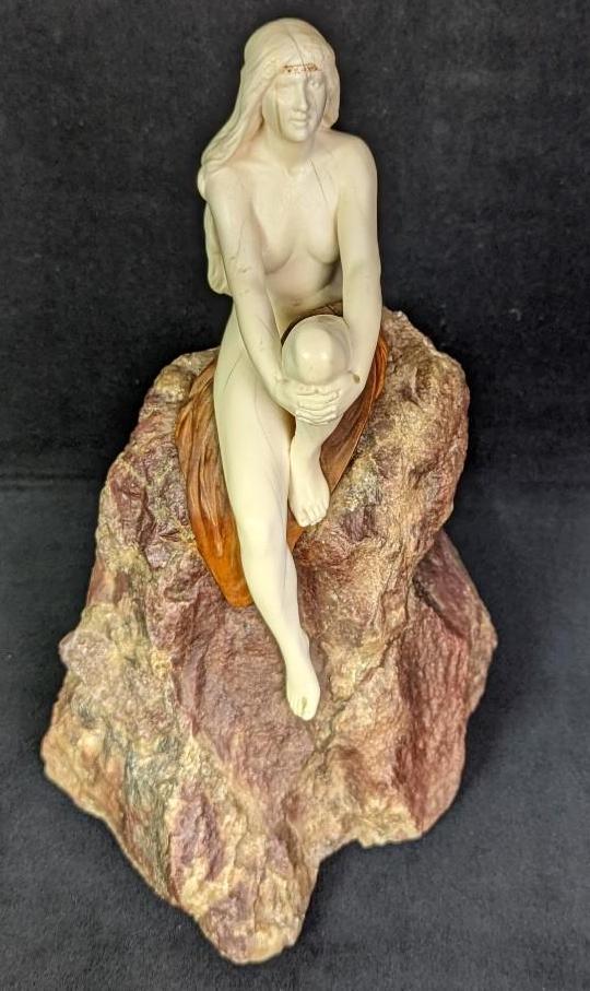 Hand Carved Nude Woman Bone Sculpture On Rock: Hand Carved Nude Woman Bone Sculpture On Rock. The rock appears to be natural Quartzite. This is signed by the artist "P. Gilles". The blanket appears to be carved wood, there is some separation on th