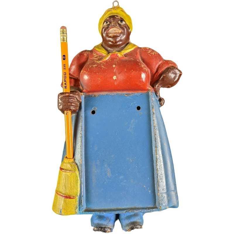 Vintage Plastic Hanging Mammy Memo Notepad Holder: Vintage Plastic Hanging Mammy Memo Note Pad Holder. Also holds one pencil which looks like an old broom on the front. A small notepad could be attached to the front. Mammy Memo is approx 6" x 2