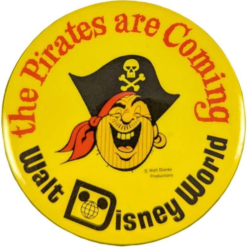 Rare Disney World Pirates Are Coming Button 1973: This pinback button was produced by Walt Disney Productions for distribution to cast members at Walt Disney World's Magic Kingdom theme park to wear in promotion of the opening of the great attrac