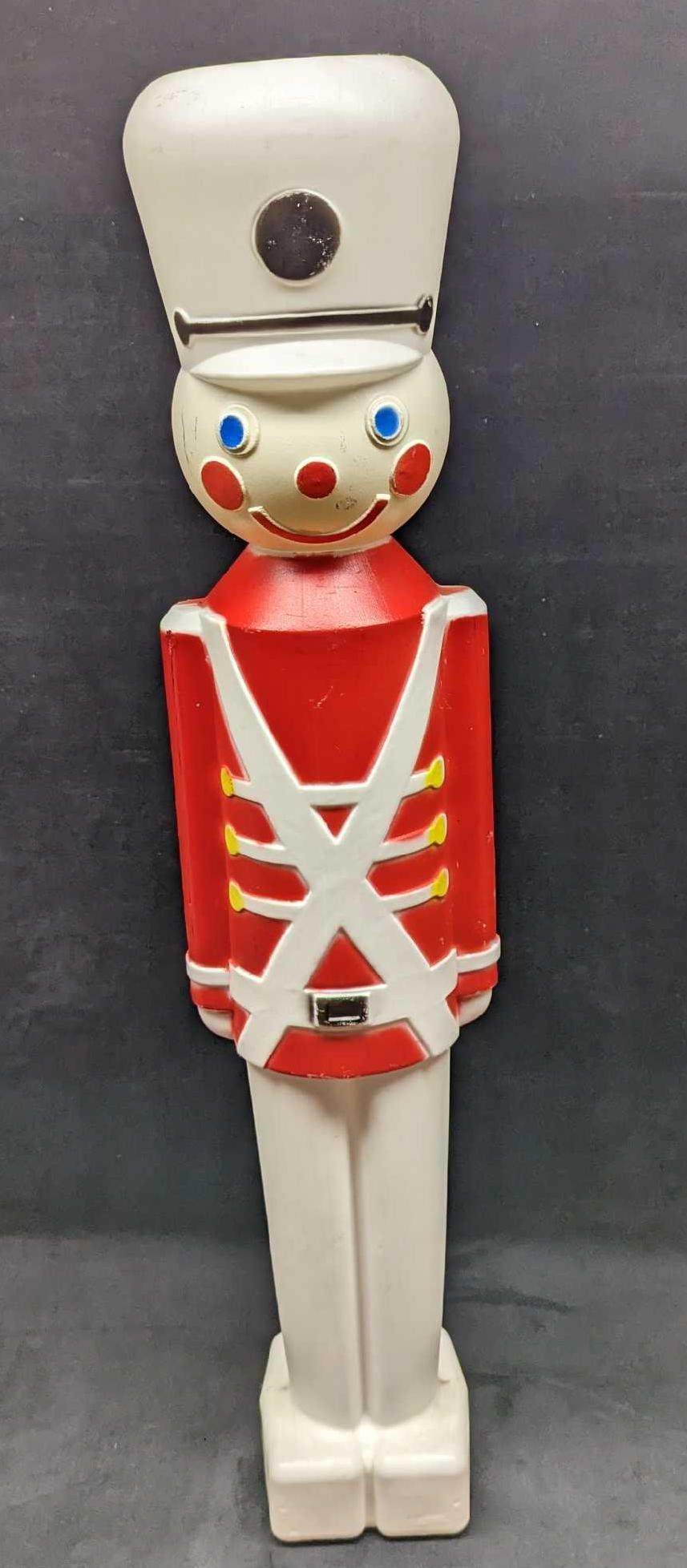 Vintage Christmas Toy Soldier Blow Mold Yard Decor: Vintage Christmas Toy Soldier Blow Mold Yard Decor. This is approx 7" x 5" x 30" and it weighs 1.25lb. It has some markings and color loss due to age and storage. Please see the images as 