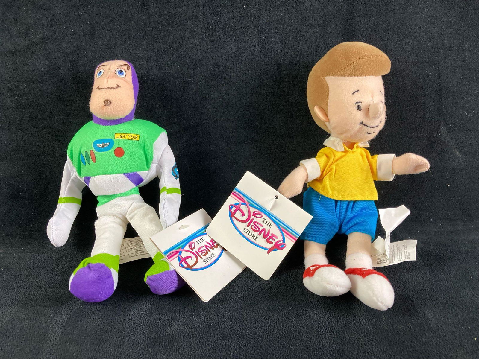 Set of (2) Disney Plush Bean Bag Dolls Buzz Lightyear and Christopher Robin: Up for auction is a recent estate find, a set of (2) Disney plush bean bag dolls that depict Buzz lightyear and Christopher Robin from the classic Disney films Toy Story and Winnie the Pooh. This auct