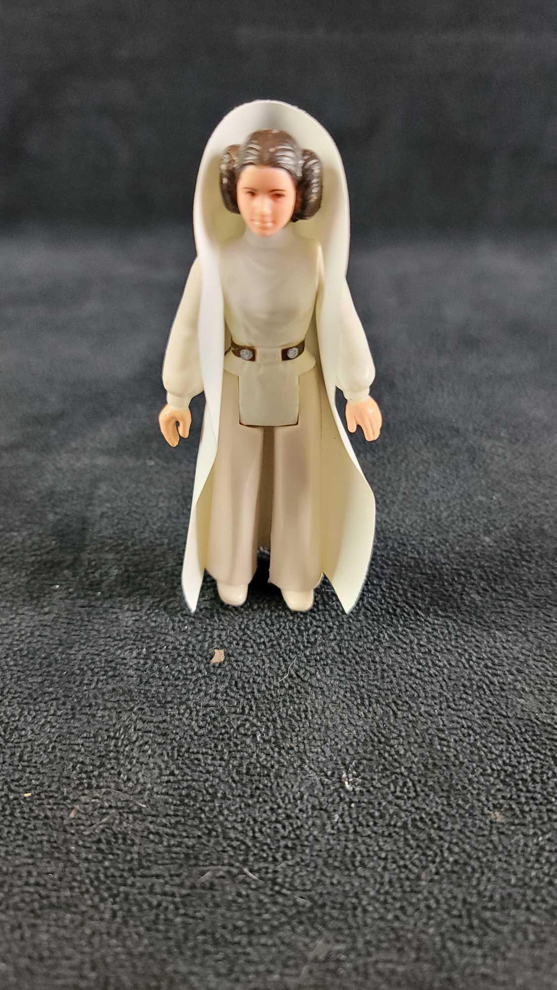 1977 Star Wars Action Figure Princess Leia: 1977 GMFGI Star Wars action figure Princess Leia with cape, missing gun. Made in Hong Kong. In good used condition. Weight is less than a pound, approx. measures 3 1/2"