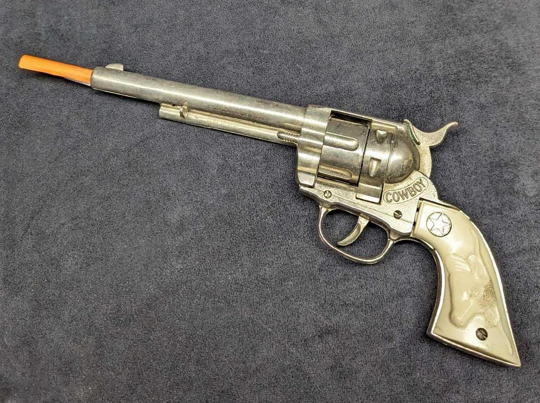 Vintage Hubley Cowboy Revolver Six Shooter Cap Gun: Vintage Hubley Cowboy Revolver Six Shooter Cap Gun. Die Cast Metal Cap Gun. Is approx 12" x 1 1/2" x 5" and it weighs 1lb. The toy gun is in a good, vintage condition with some signs of we