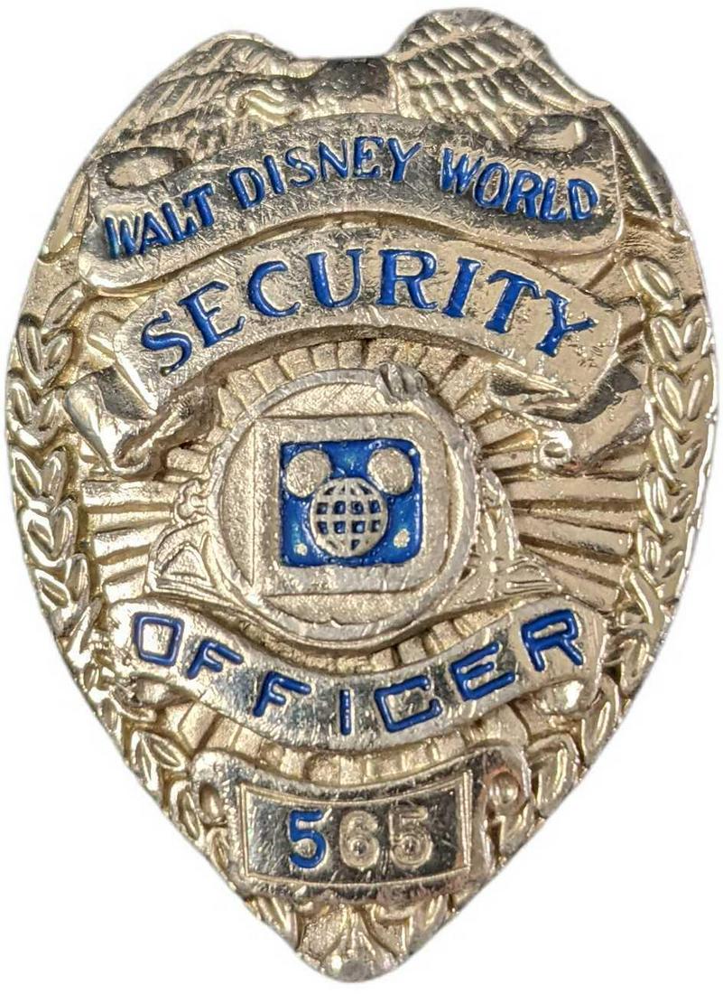 Early 1980s Disney World Female Security Metal Badge: 1970/1980s Disney World Female Security Metal Badge. Is approx 1 1/2" x 1" x 2" and it weighs under one pound at 0.11lb. The metal badge is in a good, vintage condition with some wear on t
