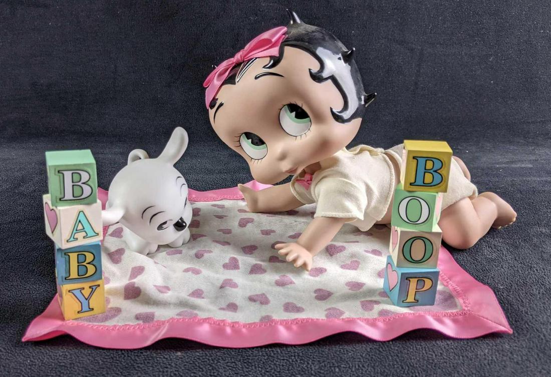 Betty Boop Baby Boop With Blocks Danbury Mint: Betty Boop Baby Boop With Blocks Danbury Mint This porcelain doll is baby Betty Boop known as Babby Boop. This set does not come in its original box, it is on a stand. The doll is approximately 8in lo