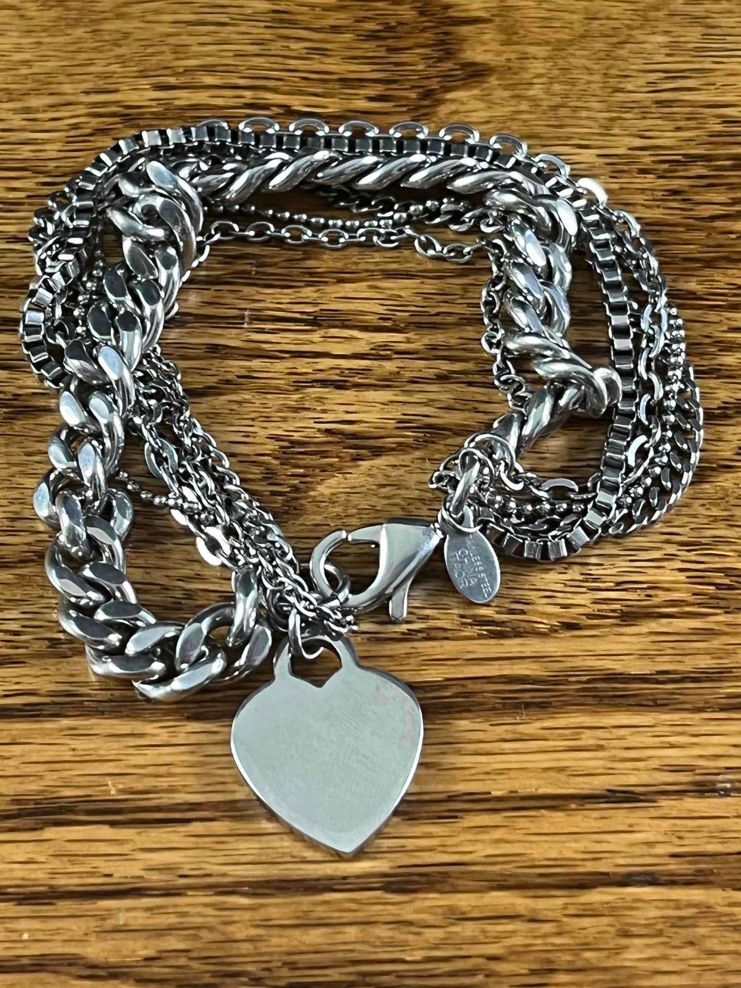 Chain Bracelet with Heart Charm: Chain Bracelet with Heart Charm This is a beautiful bracelet with a heart charm and made from different chains. This piece is made from stainless steel making it corrosion-resistant and can last a whi