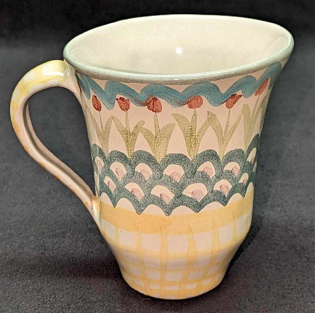 MacKenzie-Childs Pottery King Ferry Mug: MacKenzie-Childs Pottery King Ferry Mug. This retired King Ferry-style hand-painted mug is approx 11 1/4" x 11 1/4" x 1" and it weighs 0.70lb. The mug has some markings inside. MacKenzie-C