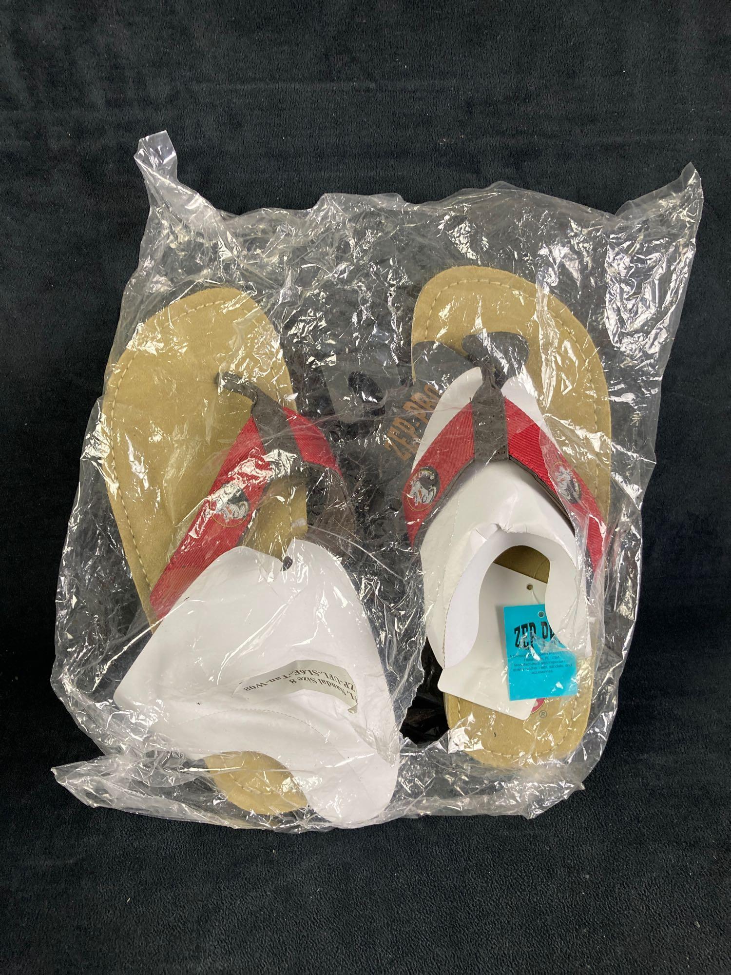 Pair of FSU Sandals Size 8: One pair of Florida State University sandals, partially opened and size 8. Fresh from recent estate. This auction includes: (1) Pair of Partially Opened FSU Sandals Size 8 Conditio
