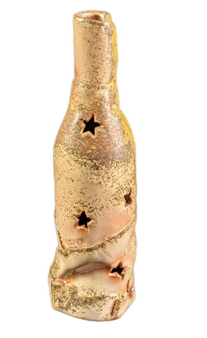 Hand Made Pottery Ceramic Star Art Bottle: Hand Made Pottery Ceramic Star Art Bottle. The maker and date of creation are unknown. Would look nice with a small LCD light tossed in as the light would come out of the star-holes. Is approx 3 1/2&#