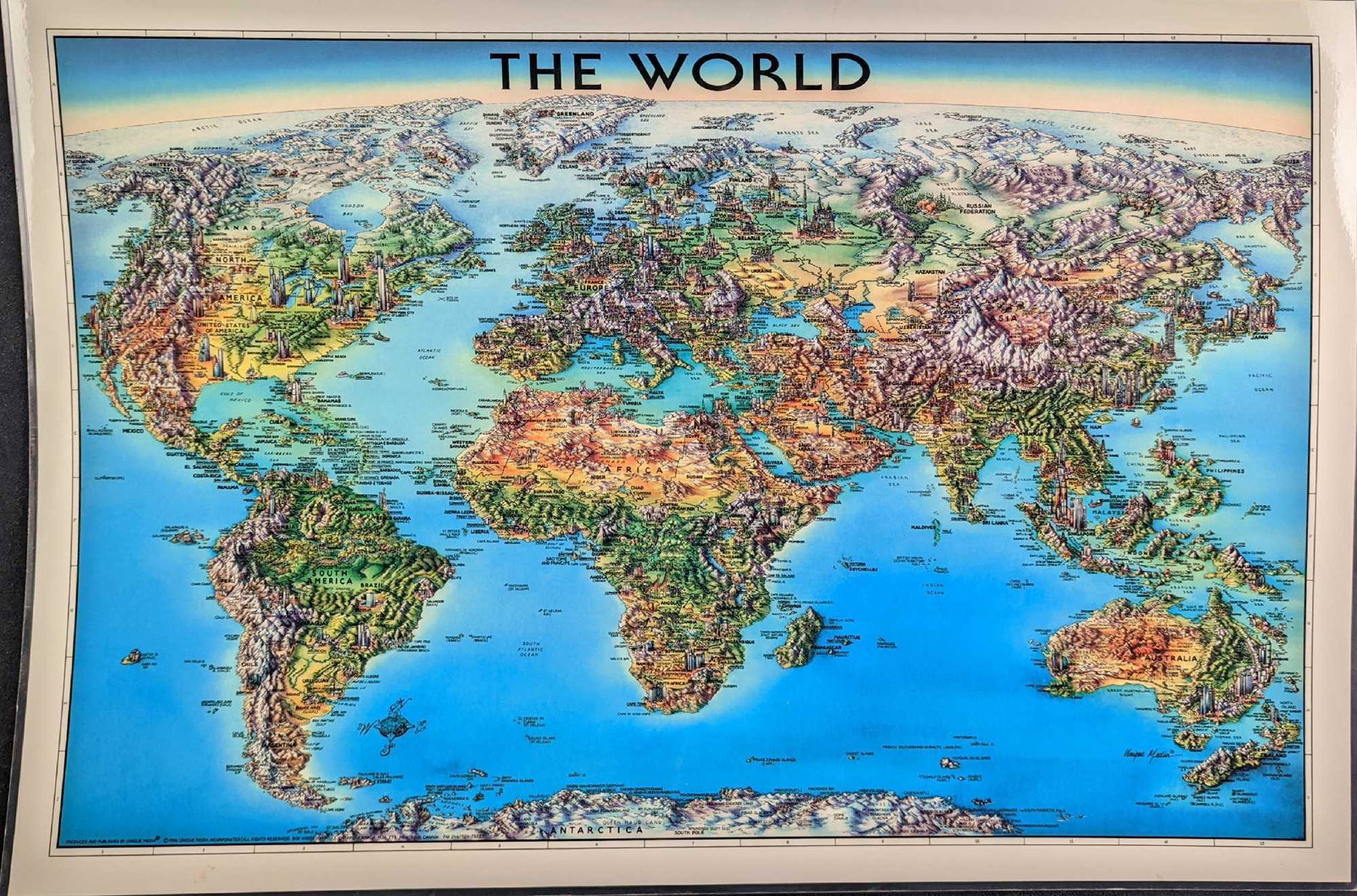 Laminated Unique Media The World Map 1996 Edition: Laminated Unique Media "The World" Map 1996 Edition. The map is approx 27" x 18 1/4" and it weighs 0.30lb. The map is in a good, used condition with light creases and scratches. Please