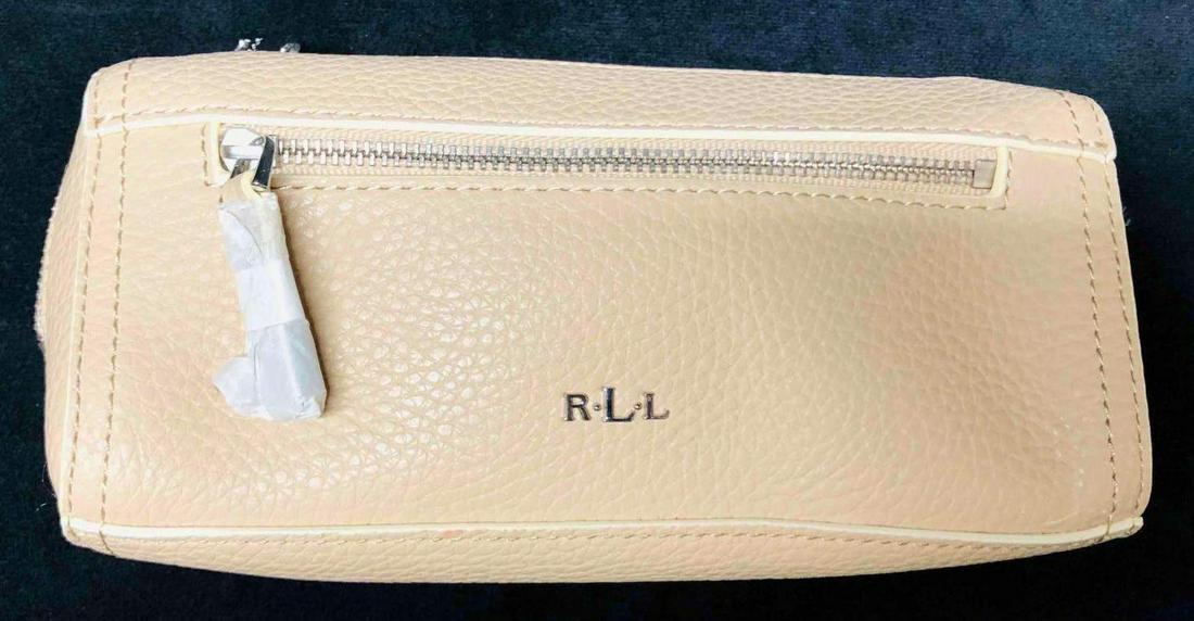 Ralph Lauren RLL Peach/Beige Cosmetic Bag: This lot contains a Ralph Lauren RLL Peach/Beige Cosmetic Bag. It is approx 7" x 2 1/4" x 3 1/4" and it weighs about 0.2lbs. Overall the Cosmetic Bag is in good used condition with some li