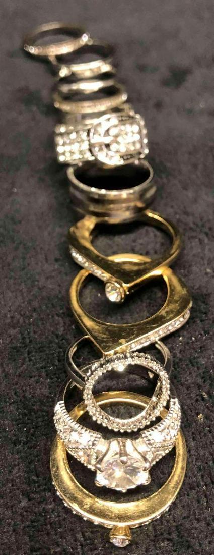 Bundle Of Vintage Fashion Silver & Gold Colored Stack Rings: This lot contains a Bundle Of Silver & Gold Colored Stack Rings. There are 12 rings total 9 silver colored and 3 gold colored. They seem to fit around a size 61/2 or 7. Altogether the rings weigh