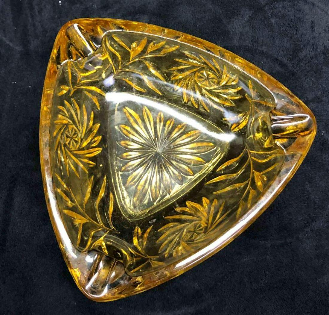 Vintage Amber Glass Ashtray: This lot contains a vintage amber glass ashtray. This ashtray is a triangular shape and is approx 6 3/4" x 6 3/4" x 2 1/4" and weighs about 1.0lbs. This ashtray is in good used condition w