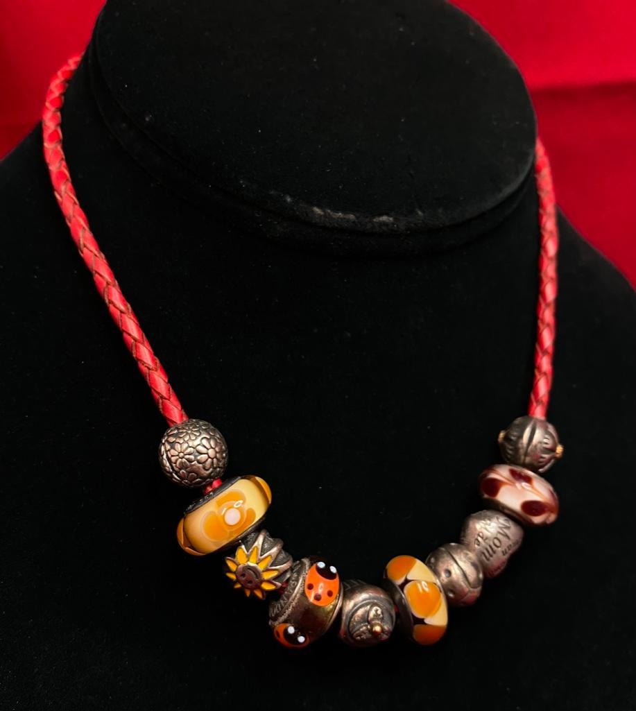 Pandora Sterling Leather Choker: This piece of jewelry as been tested and researched prior to testing . Please view all our pictures they are part of our description. DETAILS: Metal - Sterling Silver Color - Silver Stones - Glass
