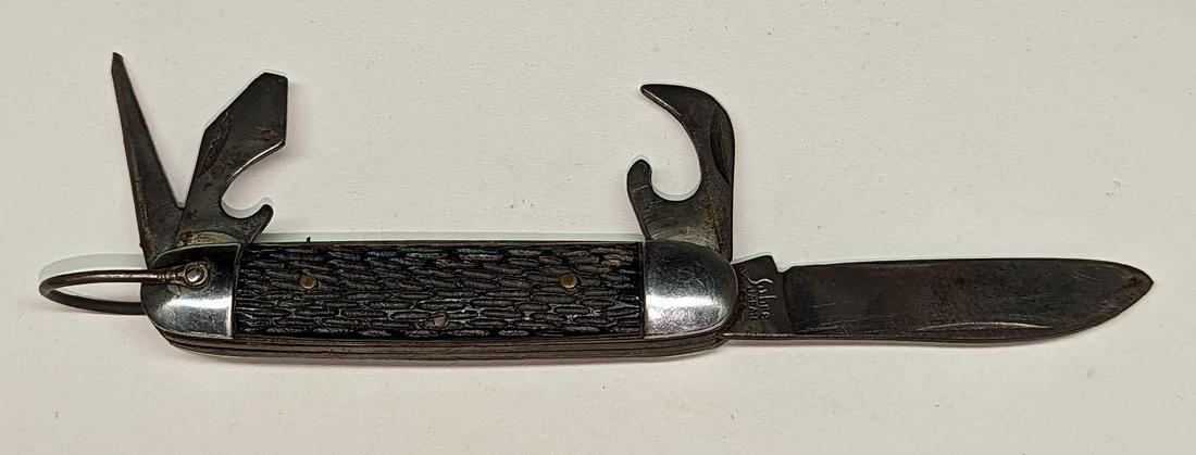 Vintage Sabre Multi Tool Pocket Knife: Vintage Sabre Multi Tool Pocket Knife. Is approx 3/4" x 4 1/2" x 3/4" and it weighs 0.18lb. Has signs of wear and light surface rust.