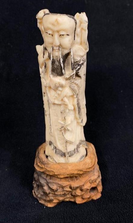 Antique Bone-Carved Confucius Statuette: Antique Bone-Carved Confucius Statuette 5" figure of Confucius carved out of bone, on a 1.5" wooden base. Confucius was an important philosopher and figure in the societal and historical devel